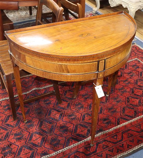 An early 19th century Dutch chequer inlaid mahogany D shaped side table W.80cm